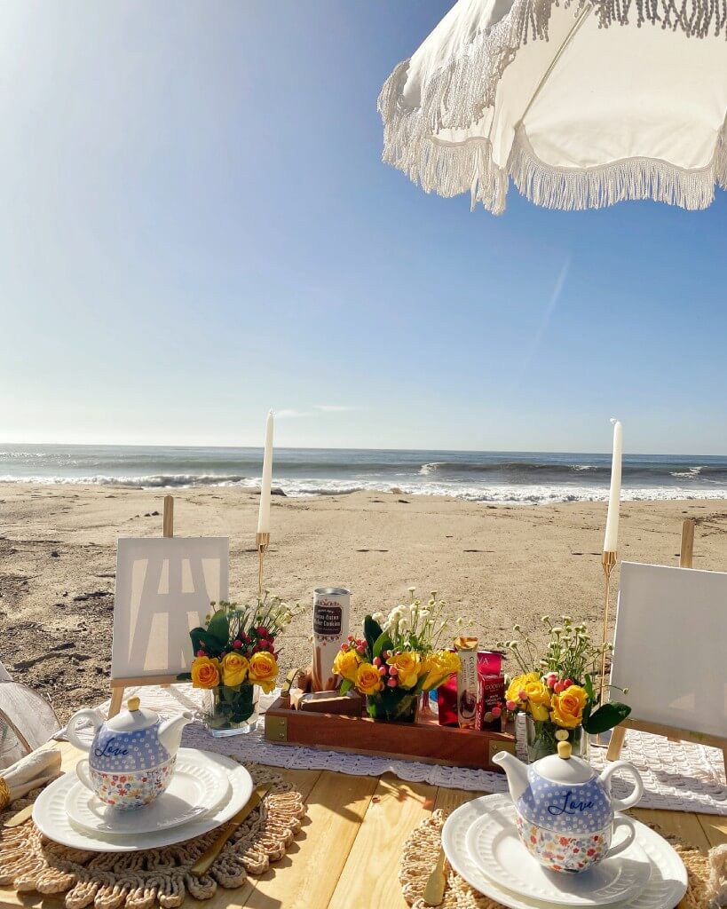 luxury pop-up picnic setup at the beach