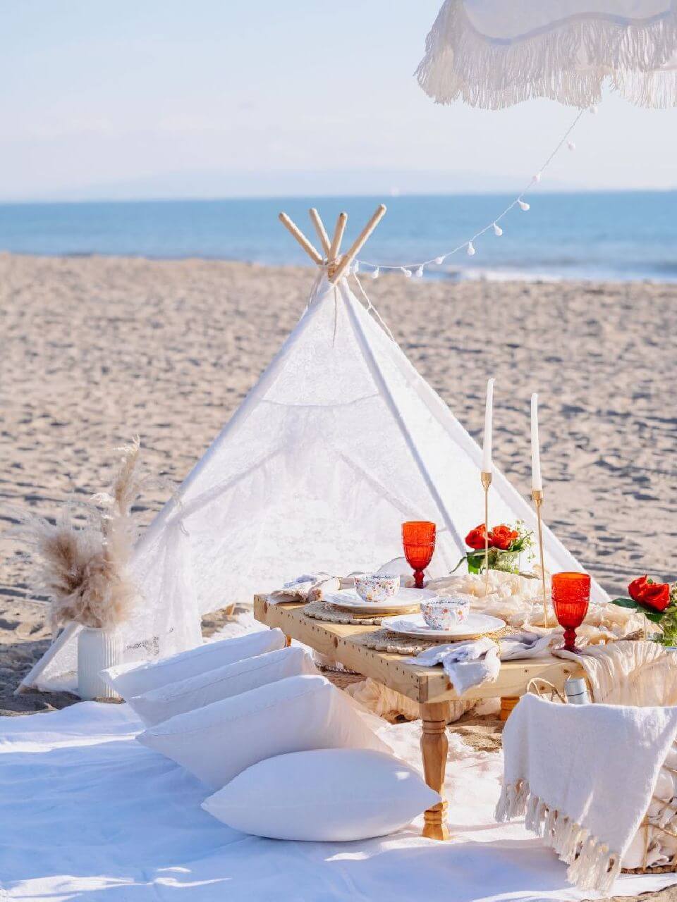 beautiful picnic pop-up setup at the beach 