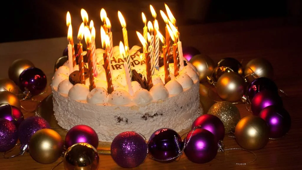 Birthday cake with lit candles