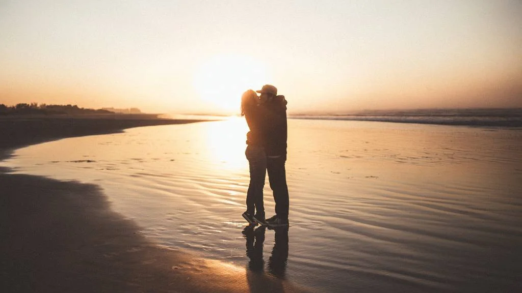 Couple during beach sunset
