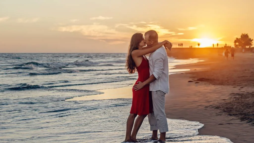 Kiss at golden hour beach