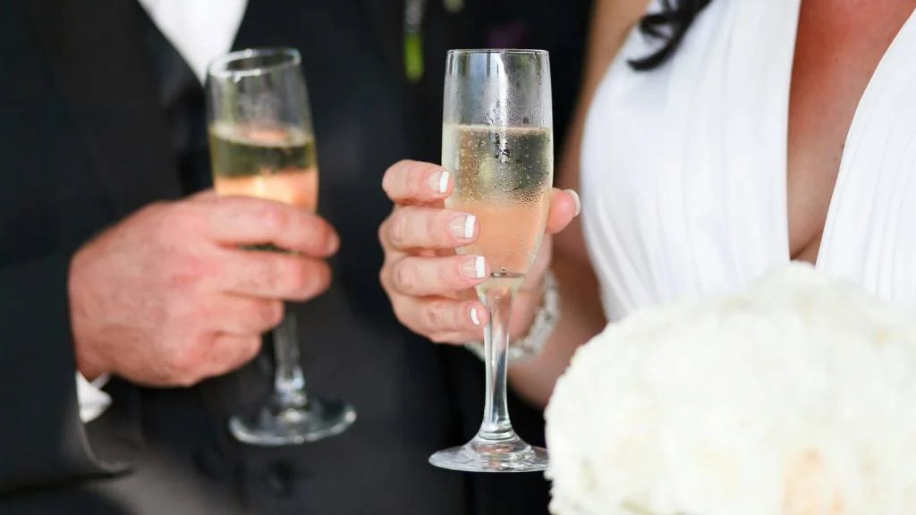 wedding toast with plastic champagne flutes