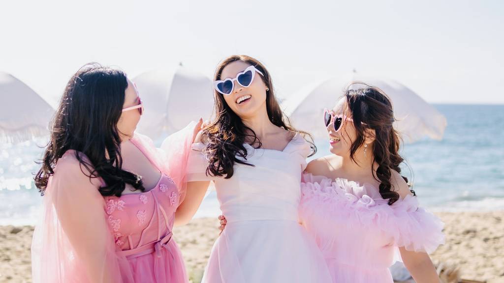 bride-to-be with friends at beach bridal shower