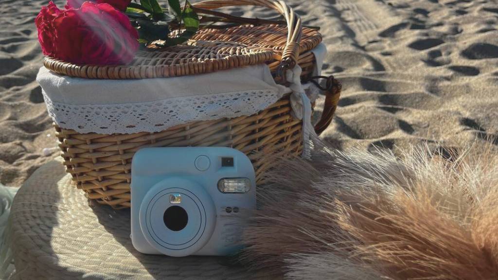 camera at beach picnic