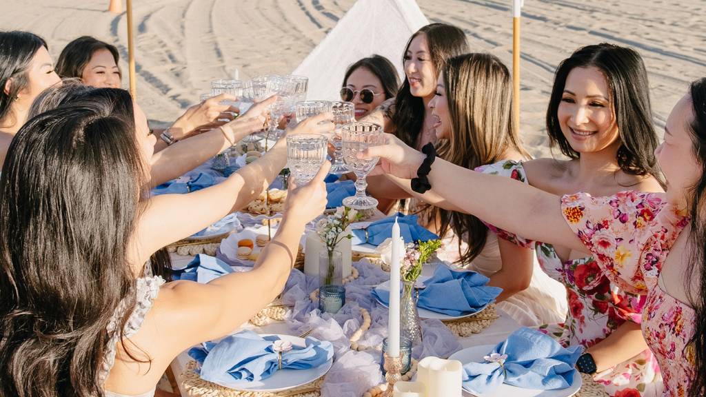 bridal shower toast at beach table