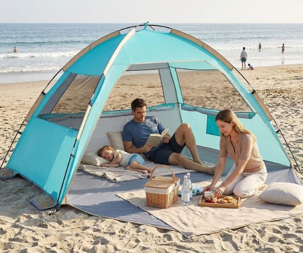 couple relaxing in a beach half tent