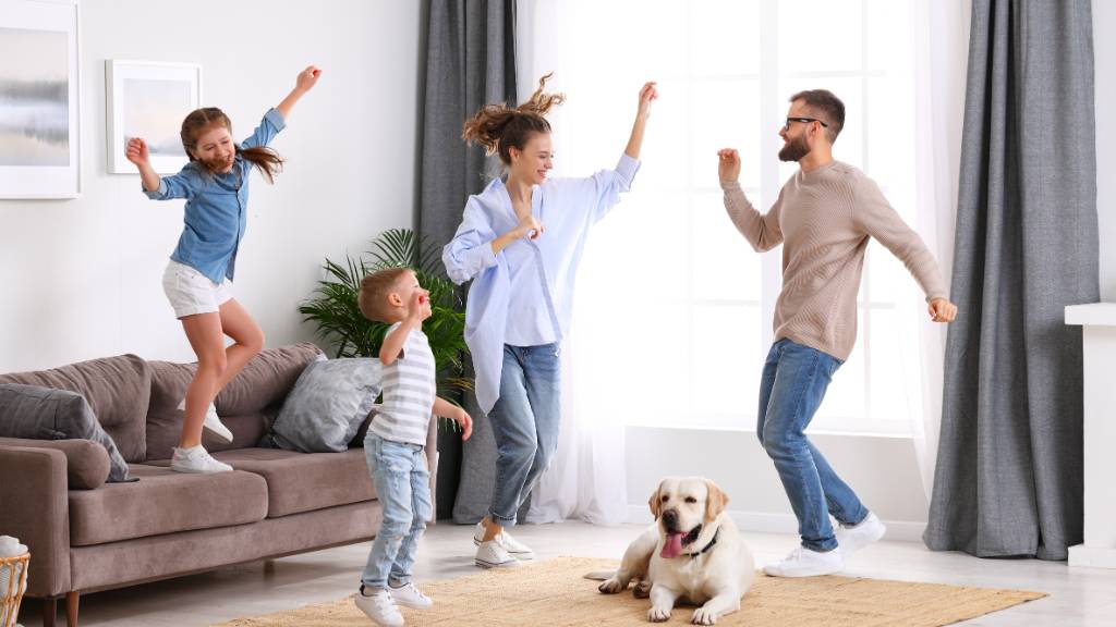 family dancing in living room