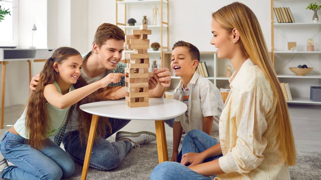 family playing board game together