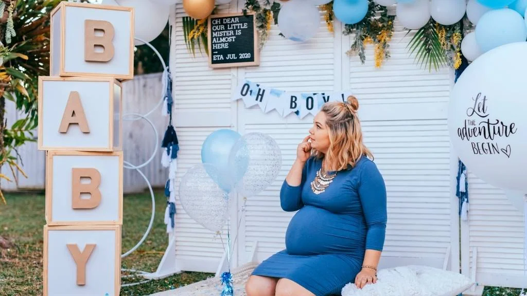 backyard baby shower setup with mom-to-be