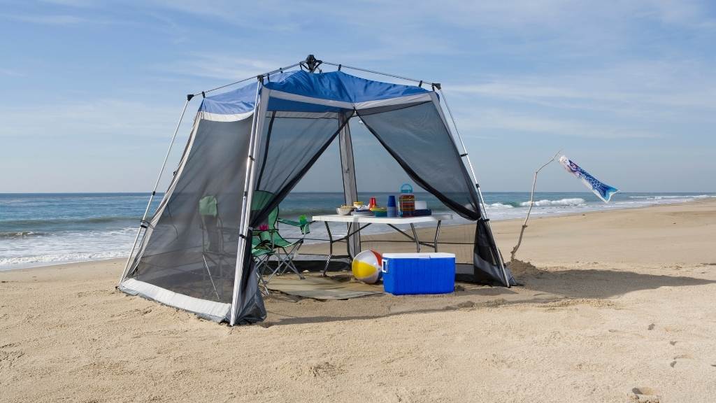 Best screen tent set up on the beach with shade and seating