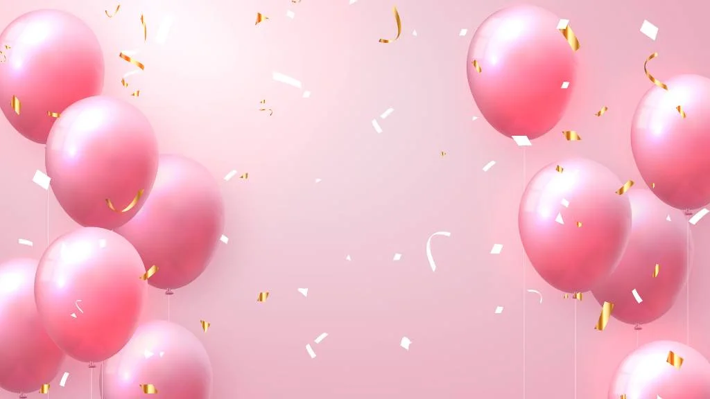 Pink helium balloons floating with confetti backdrop