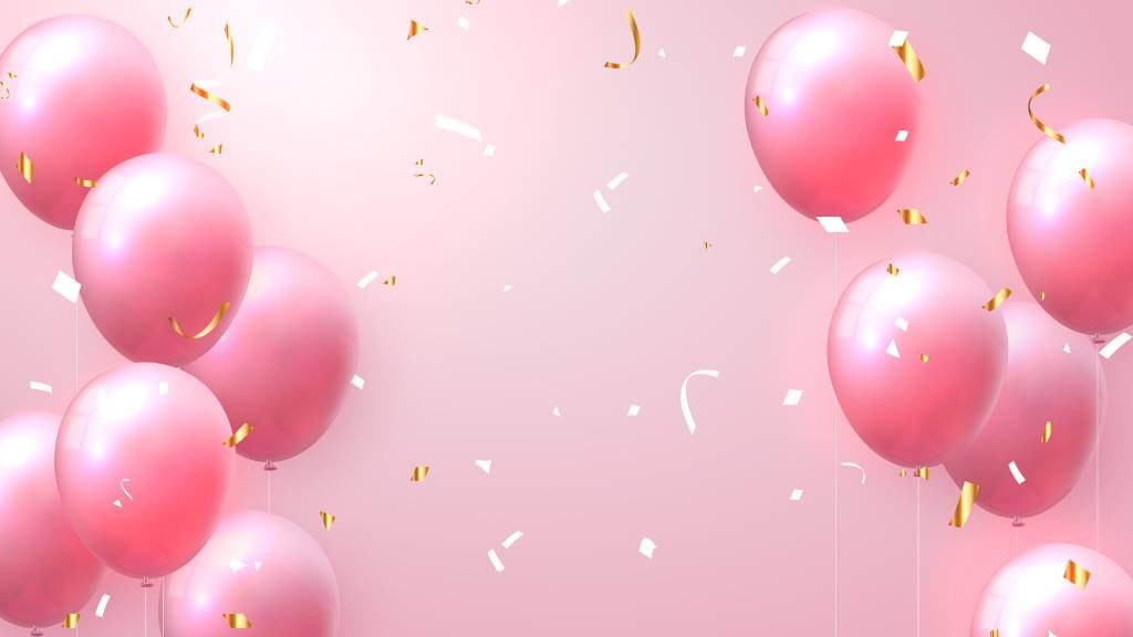 Pink helium balloons floating with confetti backdrop