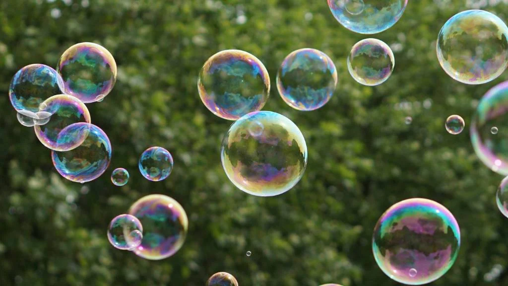 bubbles floating outdoors from bubble machine