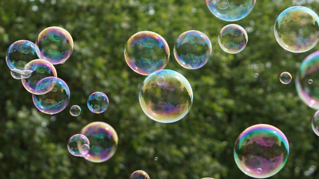 bubbles floating outdoors from bubble machine