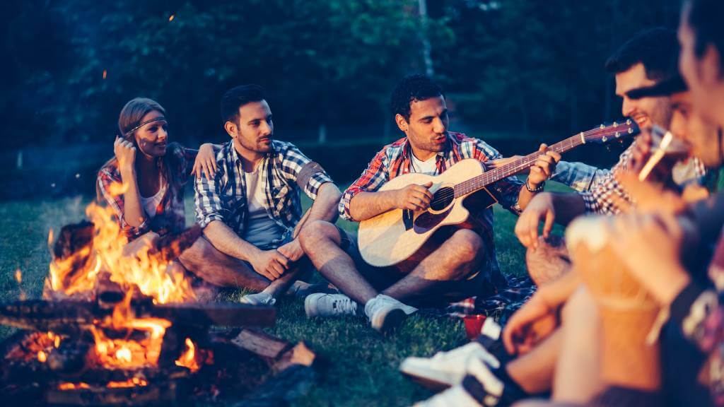 evening picnic with music by a fire