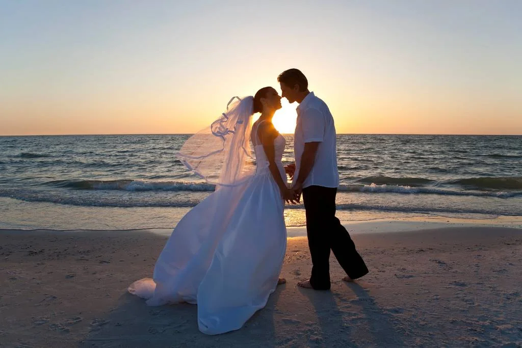 couple at sunset beach wedding