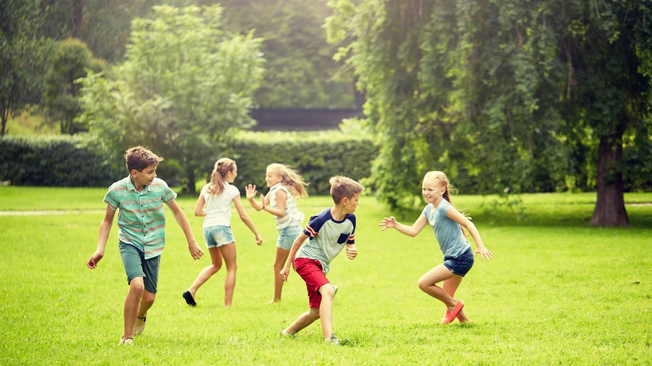 kids playing on grassy field