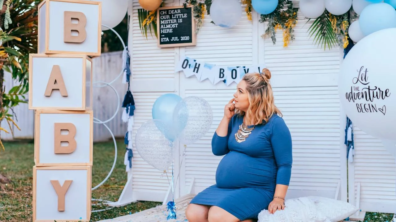 pregnant woman at outdoor baby shower setup