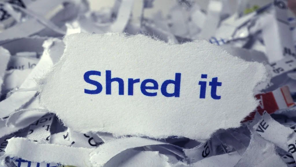 shredding papers at a divorce party