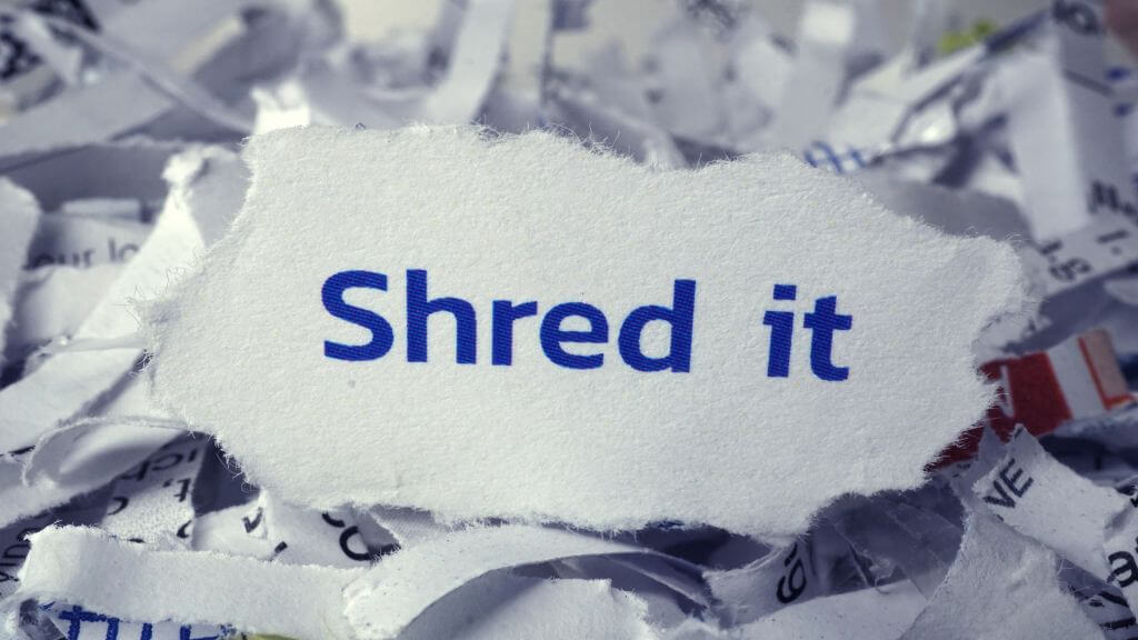 shredding papers at a divorce party