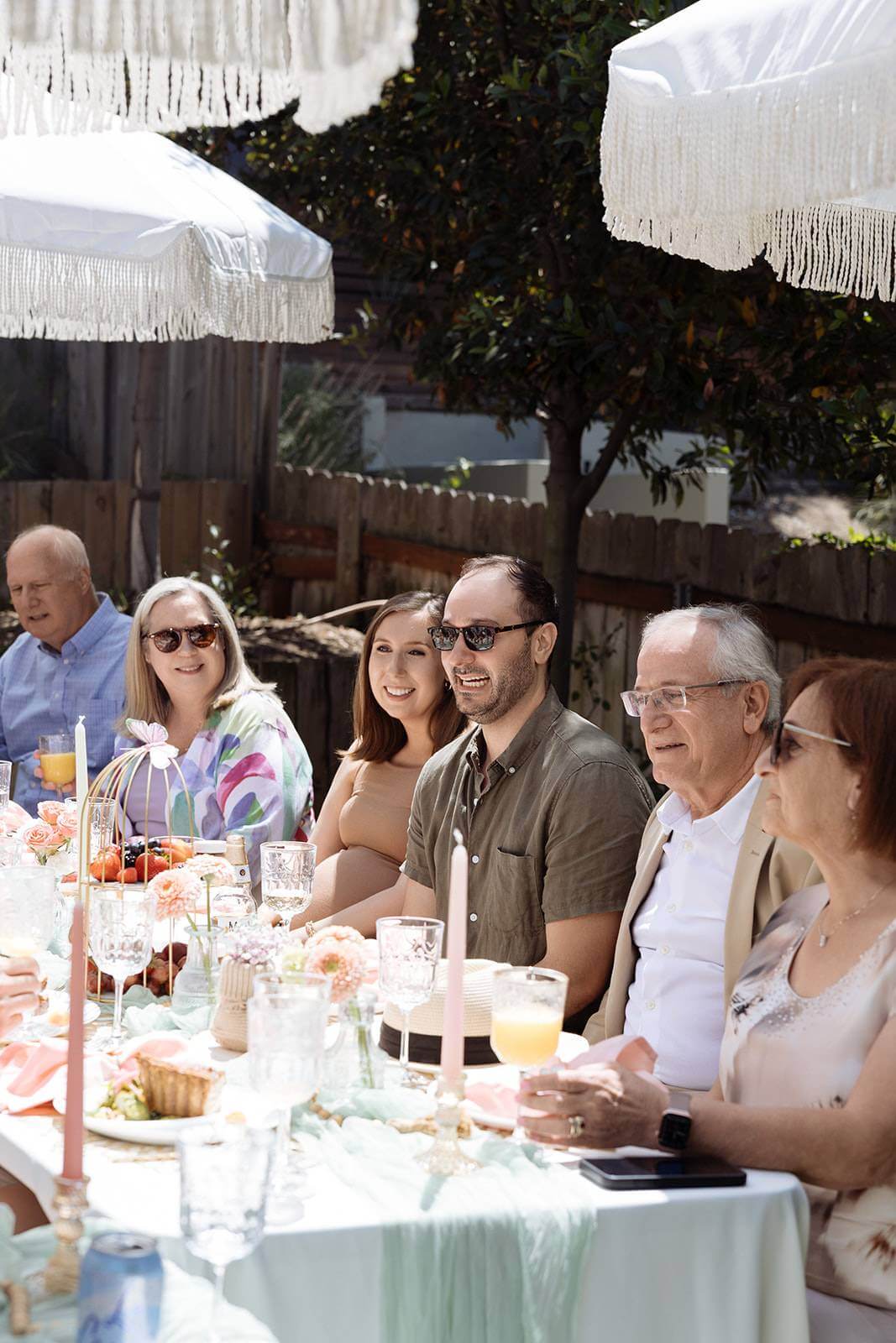 family at outdoor baby shower table