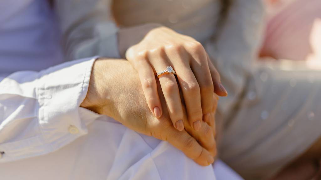 couple hands with ring
