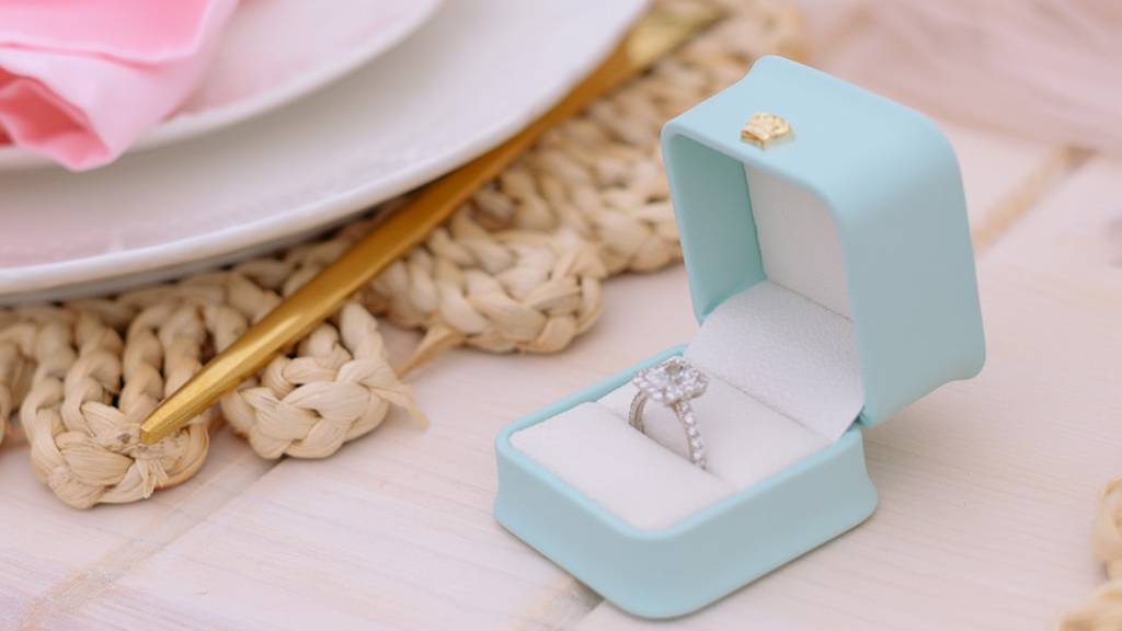 elegant engagement ring in blue box