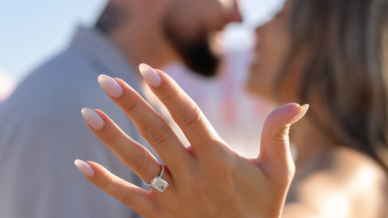 hand showing engagement ring closeup