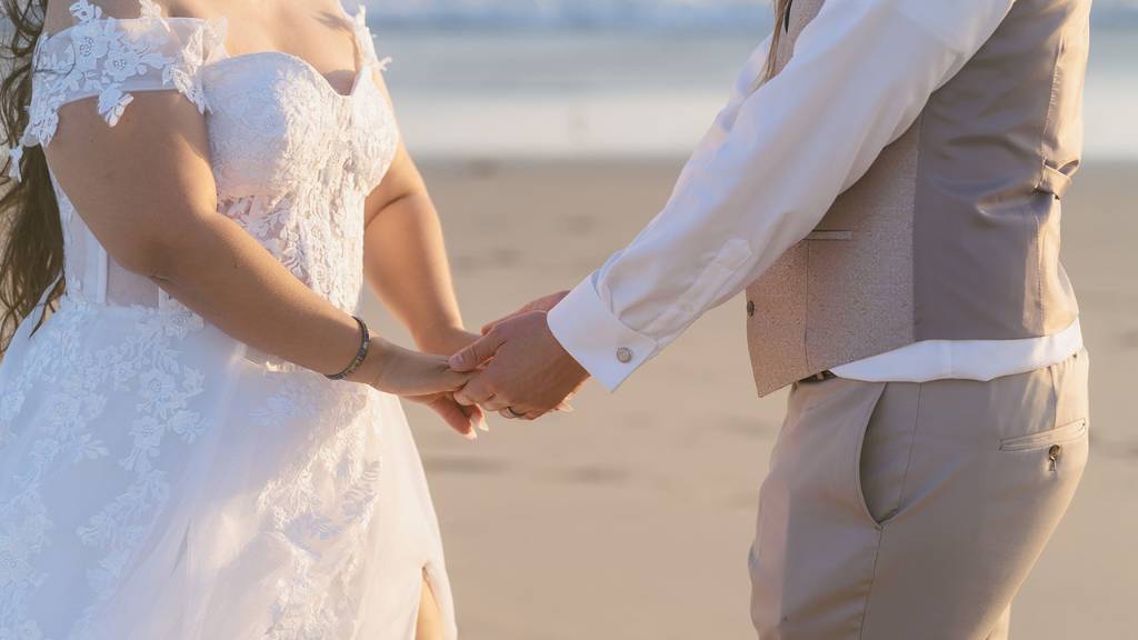 holding hands wedding ceremony