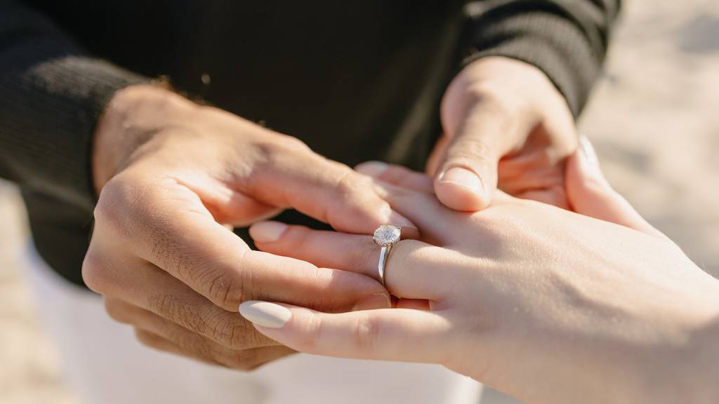 slipping on engagement ring