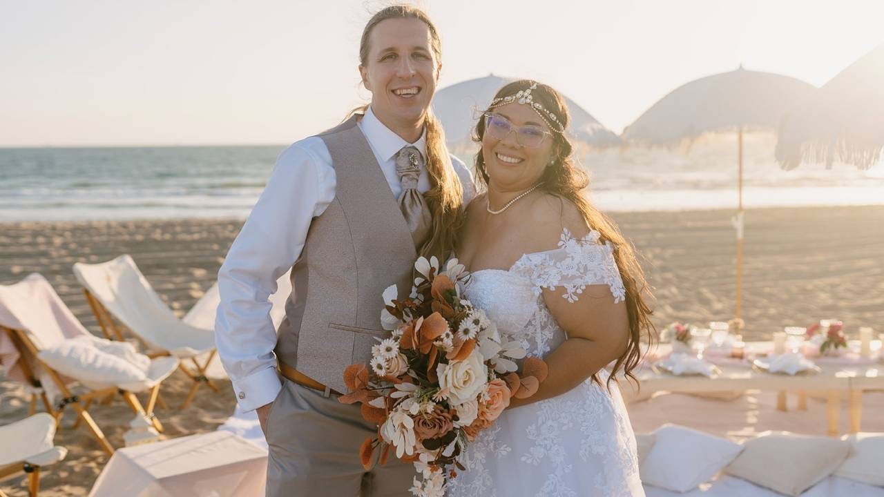bride and groom in their wedding smiling