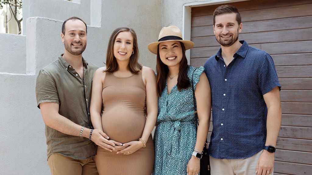 couple with friends before welcoming baby teo