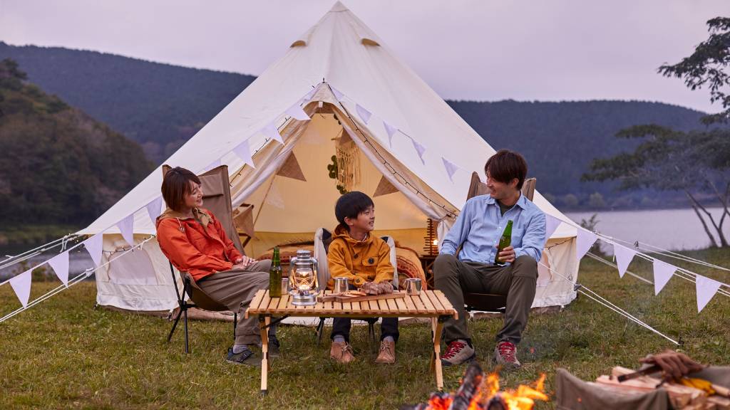 family glamping under picnic tent