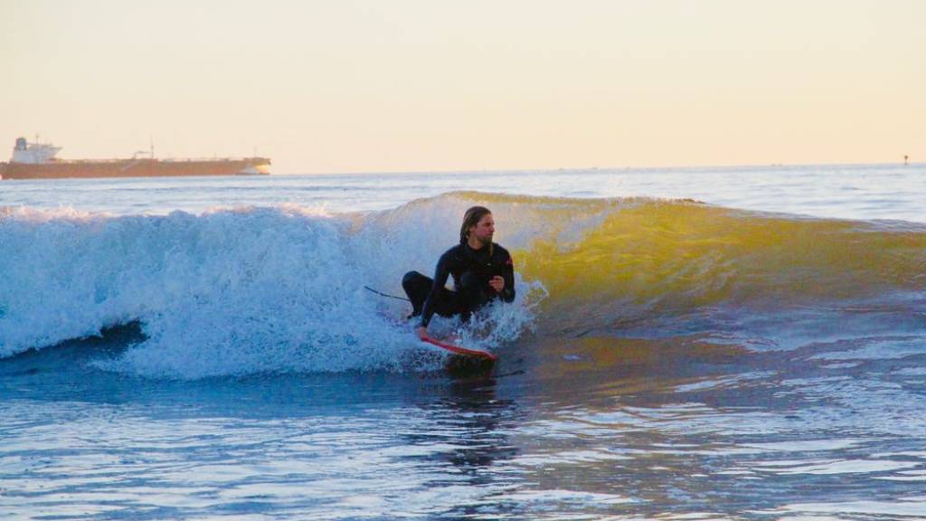 surfer at dockweiler state beach