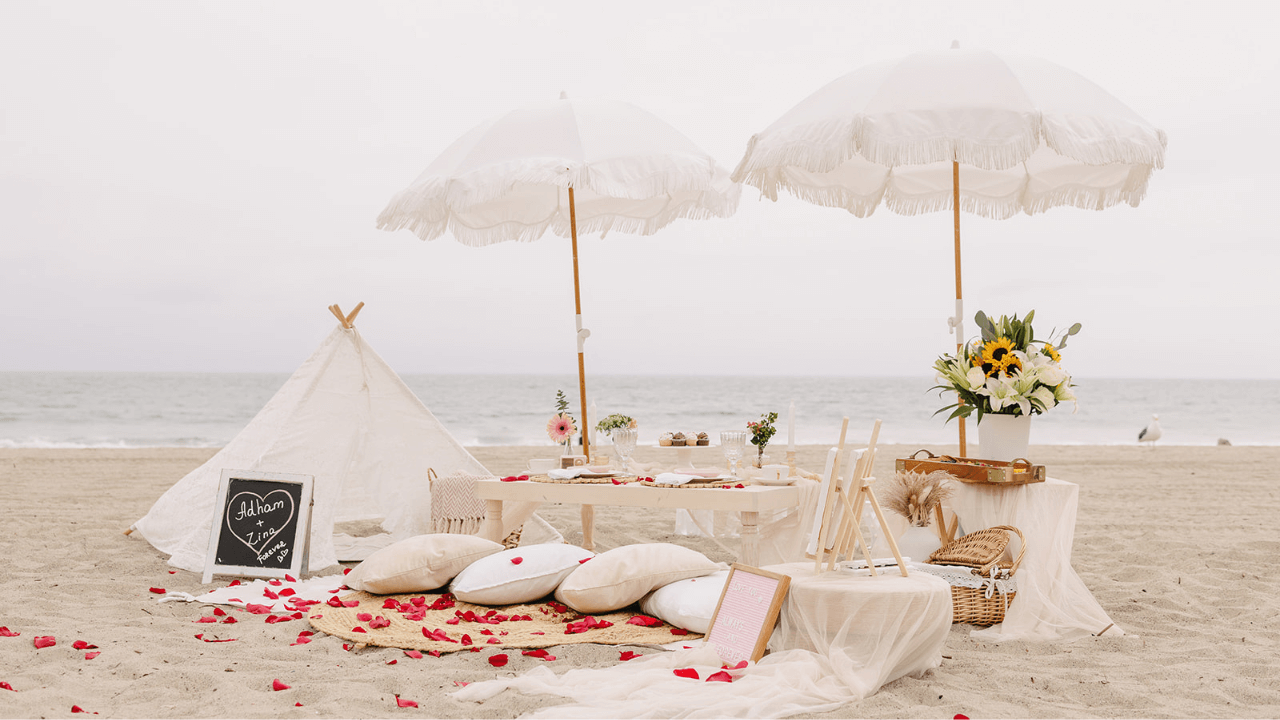 luxury-beach-picnic-setup-picnic-checklist-featured-image luxury beach picnic setup with umbrellas