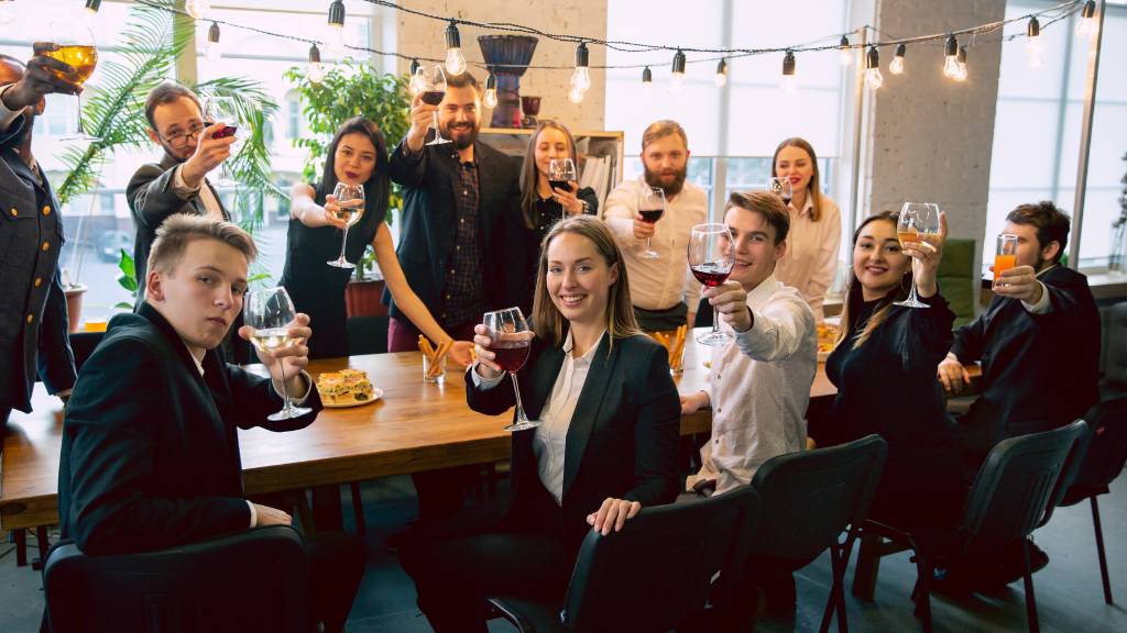 office group cheers at thanksgiving party