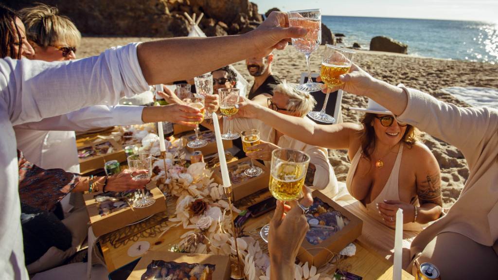 team toasting thanksgiving dinner outdoors