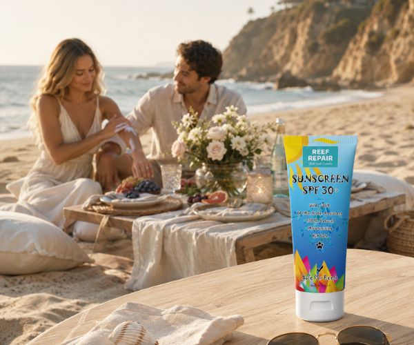 Reef Repair SPF 30+ sunscreen beside a romantic luxury beach picnic in Laguna Beach