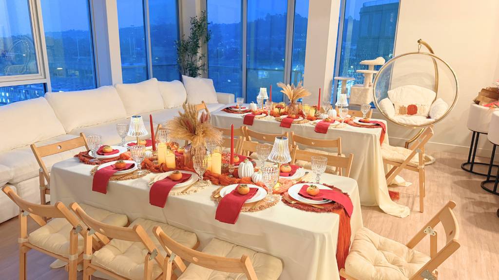 Colorful Bachelorette Party Table Colorful bachelorette party table with bright place settings, floral decorations, and ocean views