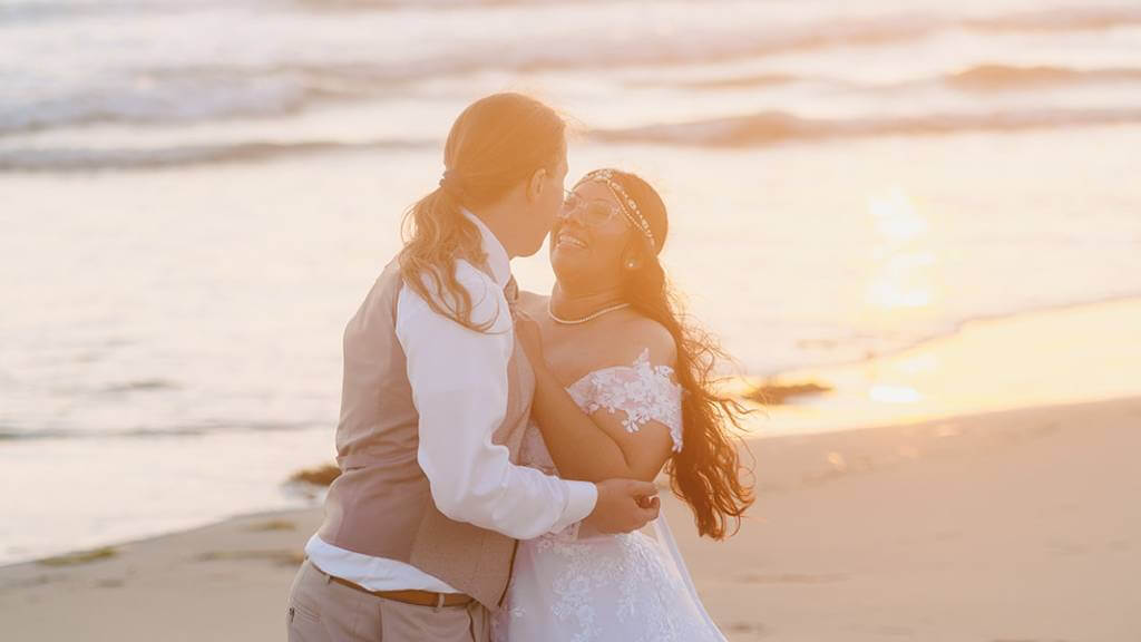 newlywed couple on sunset beach