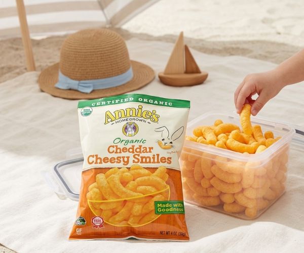 Annie’s Cheddar Cheesy Smiles protected in a firm container at the beach