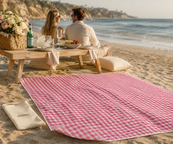 JIYQINLY pink gingham beach blanket at a romantic luxury picnic on the California coast