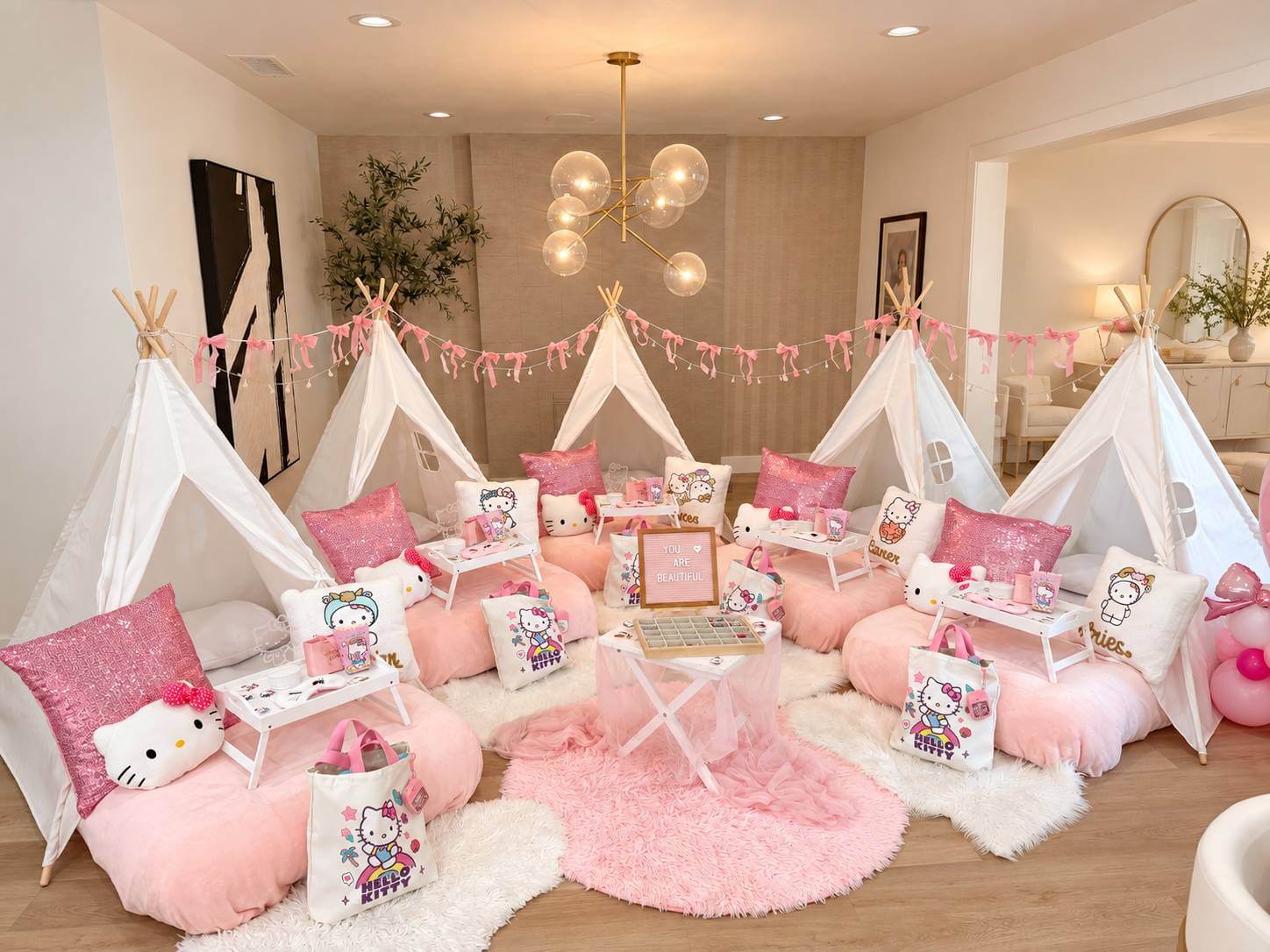Luxury Sleepover Party Rentals Los Angeles – Hello Kitty Theme Luxury Hello Kitty themed sleepover party setup with teepees and pink bedding by Picnic Makers in Los Angeles